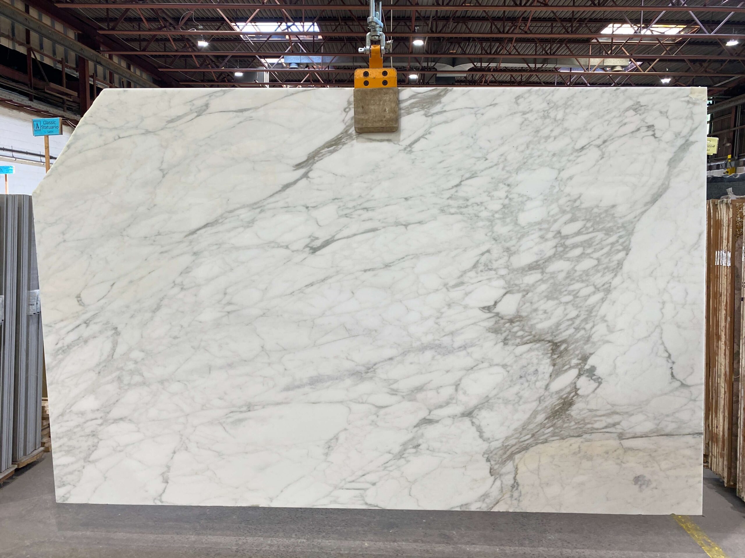 The milky white surface of our Calacatta Caldia marble is delightfully decorated with shades of large, light grey brecciated accents. Calacatta Caldia - Lot 2414 2cm Polished & Honed, 118" x 77" | Arena Stone NJ Arena stone nj calacatta caldia lot 2414 2cm polished honed calacatta caldia lot 2414 2cm polished honed 118 x 77