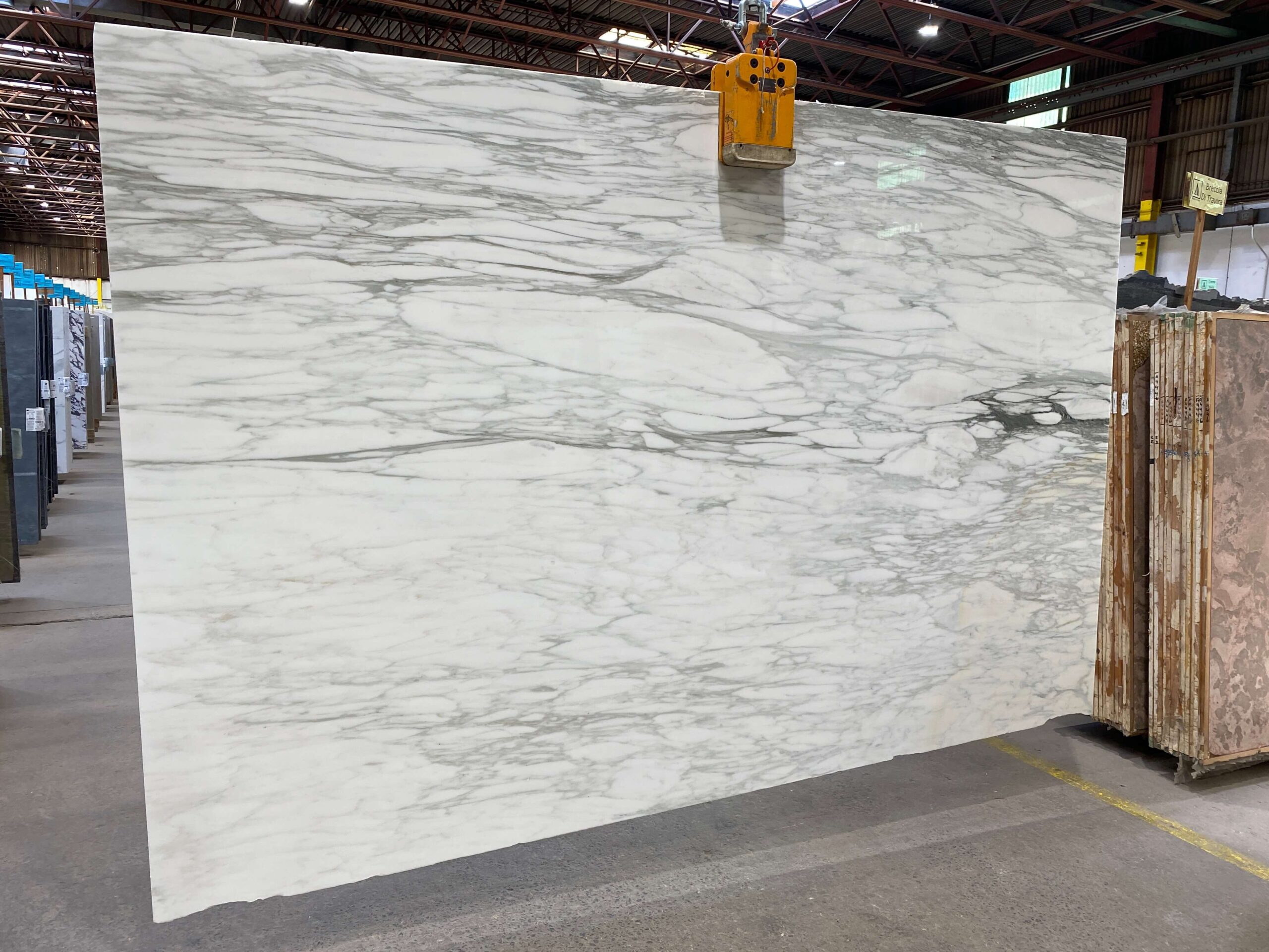 The pristine white surface of this Calacatta Caldia marble is perfectly accentuated by prominent gray veins and a subtler vein pattern, making this stone a popular choice. Calacatta Caldia - Lot 2415 2cm Polished & Honed, 118" x 77" | Arena Stone NJ Arena stone nj calacatta caldia lot 2415 2cm polished honed calacatta caldia lot 2415 2cm polished honed 118 x 77