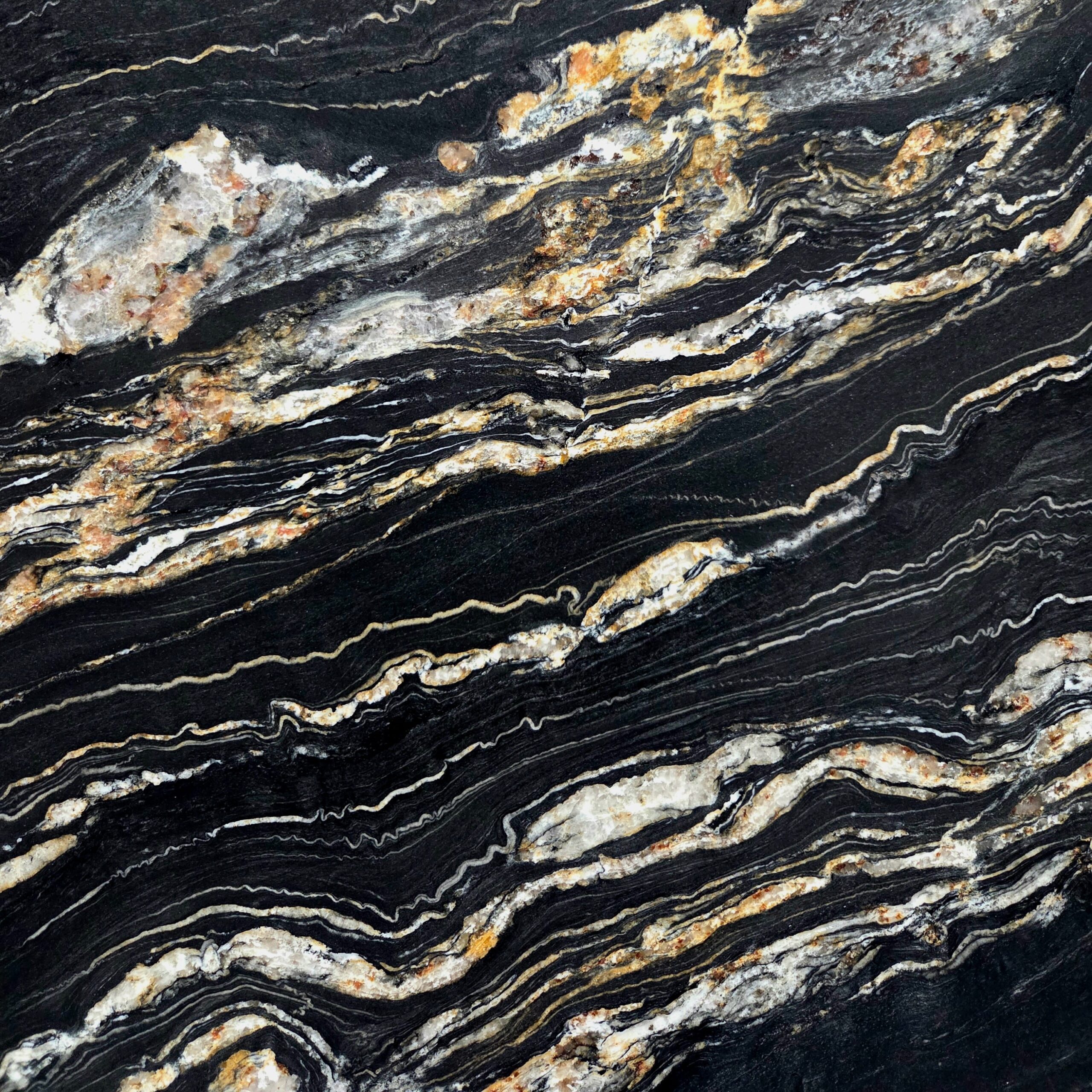Portoro Quartzite features a dramatic black background layered with striking gold and ivory veining. This leathered natural stone adds bold movement, depth, and luxurious contrast to high end interiors. Quartzite Portoro - Lot 2615 | Arena Stone NJ Arena stone nj quartzite portoro lot 2615 2cm leathered quartzite portoro lot 2615