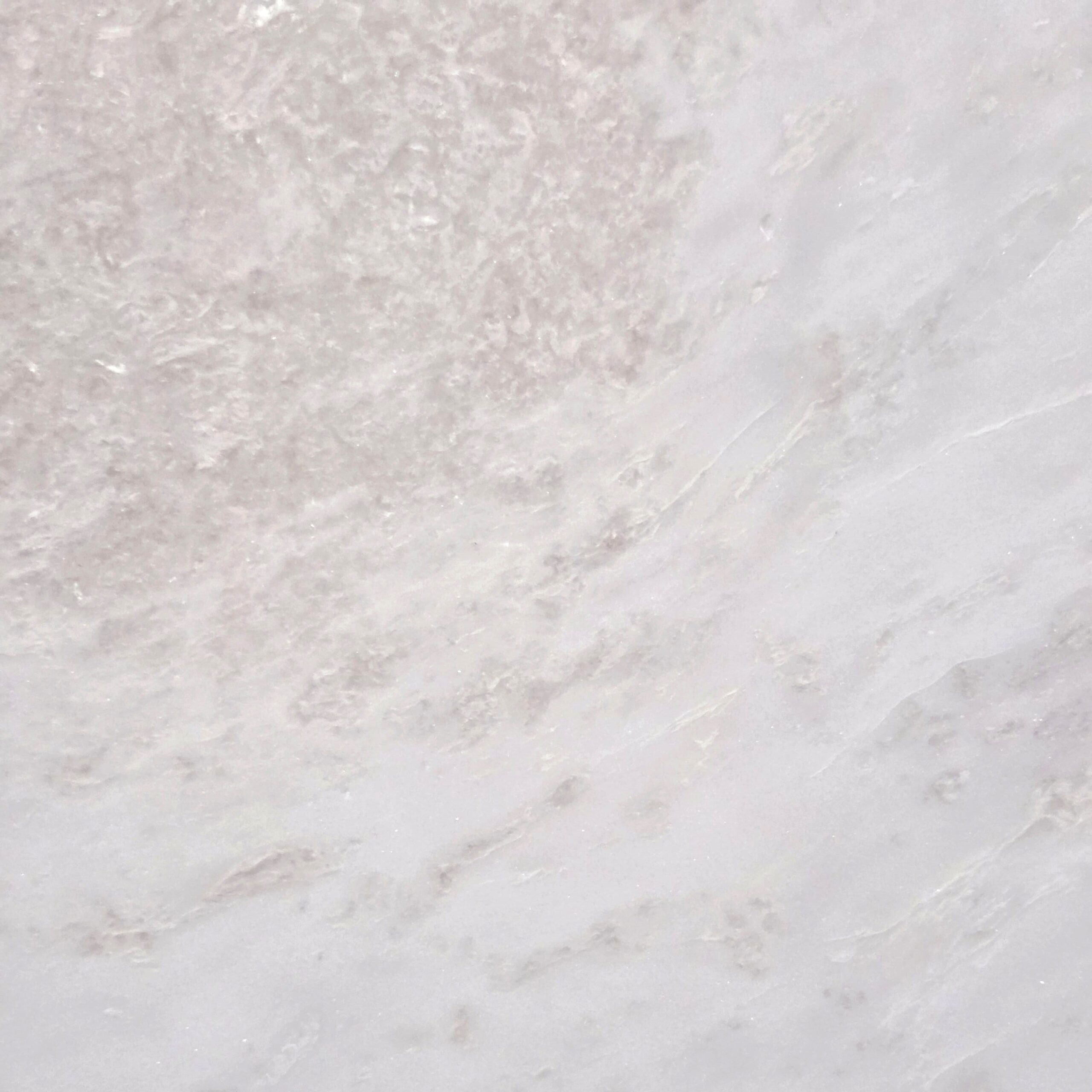 Rhino White marble features a creamy white background with soft gray undertones, creating a cloud-like aesthetic. This polished marble offers understated elegance, ideal for refined interior spaces. Rhino White - Lot 2626 | Arena Stone NJ Arena stone nj rhino white lot 2626 2cm polished rhino white lot 2626