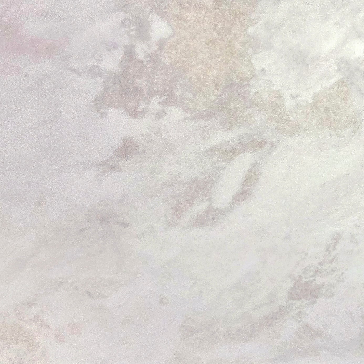 Rhino White marble features a creamy white background with soft gray undertones, creating a cloud-like aesthetic. This polished marble offers understated elegance, ideal for refined interior spaces. Rhino White - Lot 2626 | Arena Stone NJ Arena stone nj rhino white lot 2626 2cm polished rhino white lot 2626